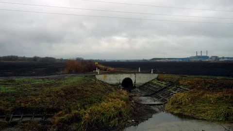 General plan field gutter gray weather and dark clouds, contaminated Stock Footage 123957551