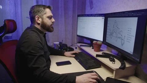 The general plan of how a man works at home on a computer. Stock Footage 237173090