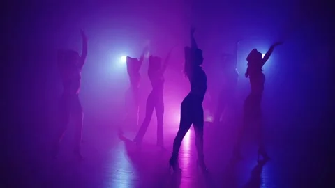 A general plan in which a large number of girls perform dance in high heels. Stock Footage 239629021