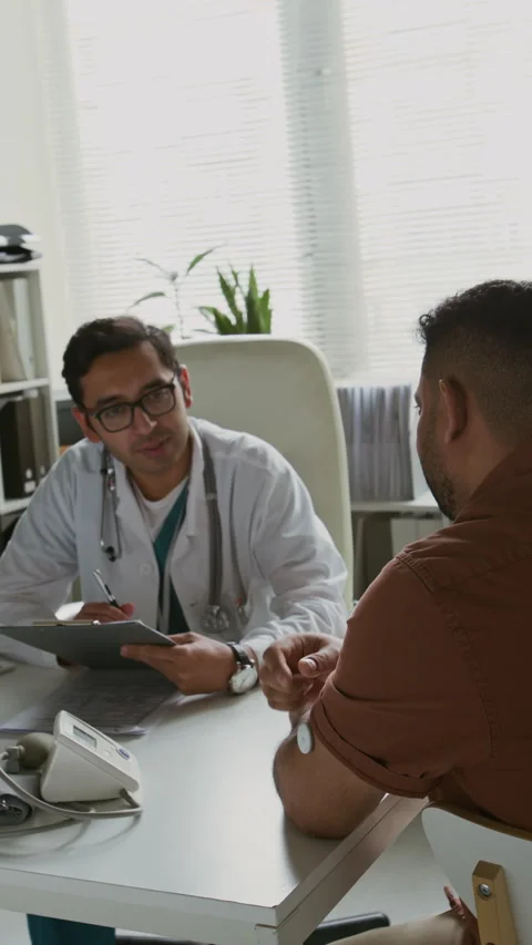 General Practitioner Consulting Patient with Glucose Monitoring System Patch Video stock 310312052