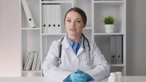 A general practitioner gives advice and conducts consultations via video Stock Footage 275191430