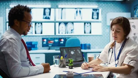 General practitioner putting his stamp on a prescription document Stock Photos