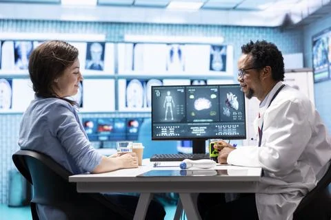 General practitioner putting his stamp on a prescription document Stock Photos