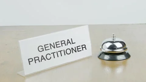 General Practitioner Room Office or Room with Hand Ringing The Bell on Desk Stock Footage 300721437