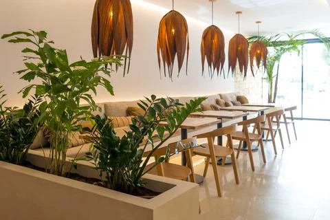 General shot of an empty rustic restaurant in broad daylight due to the low.. Stock Photos