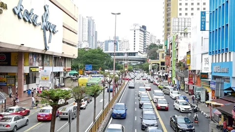 General traffic view of Kuala Lumpur nearby Petaling Street in Malaysia. Видео 80861977