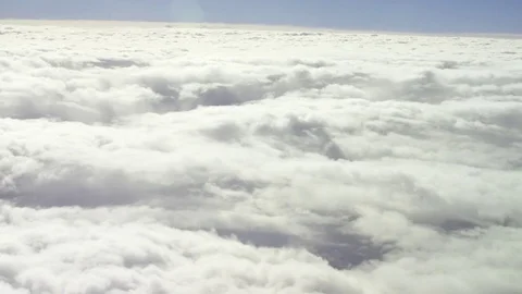 General view from the airplane window during a flight to fluffy thick clouds Stock Footage 73797627