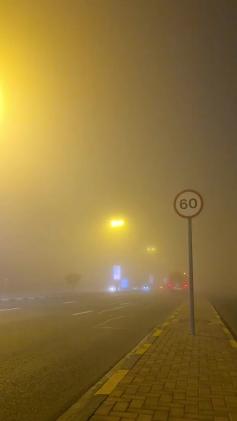 A general view of dense fog covering Sharjah, as low visibility affects roads Stock Footage 331186603