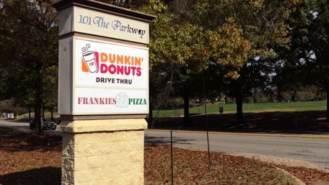 General View of Dunkin Donuts Brand Logo. Dunkin' Donuts, an American multi.. Видео 303371859