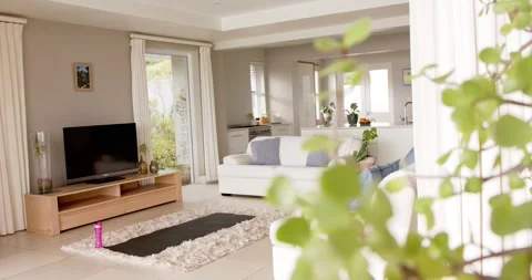 General view of light modern interiors with sitting room with sofa and tv, copy Stock Footage 340068472