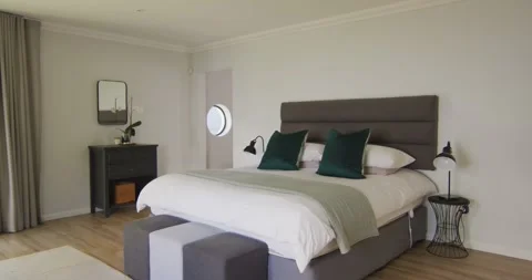 General view of luxury bedroom with large bed and night tables Stock Footage 336482992