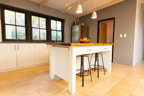 General view of luxury interior of kitchen with countertop and fridge Stock Photos