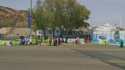 General view from a moving bus of accommodation tent for hajj pilgrims in Mina Stock Footage 318524642