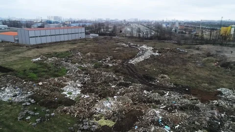 General view of a pile of construction debris plastic lie near the road illegal Vídeos de archivo 150829066