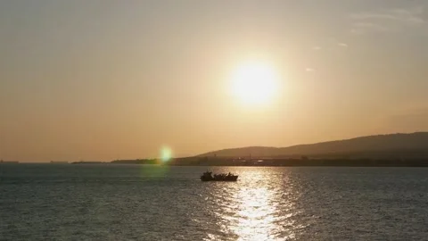 General view of the ship floating on the sea in the sunlight of sunset 스톡 동영상 133132686