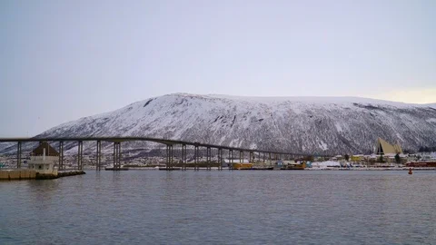General view of the Tromsø Bridge with the Arctic Cathedral in the distance Stock Footage 126212749