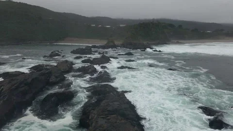 General view of two beaches with ocean water splashing on rocks 4K 60fps Video stock 291505708