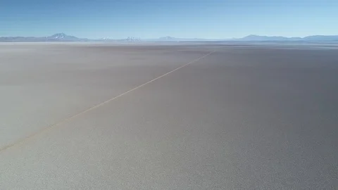 General view of white wide salar with track crossing along 스톡 동영상 103438361