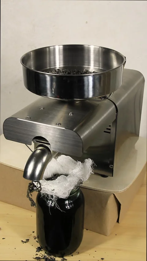General view of a working oil press. The jar is almost full to the brim. Stock Footage 168888648