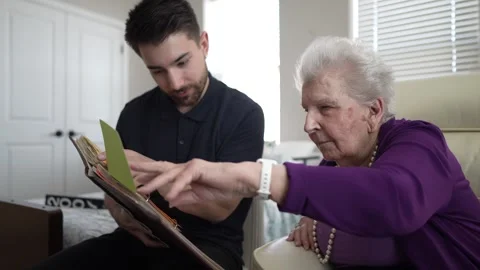 Generations Come Together to Share Memories and Stories in a Warm Family Visit Stock Footage 306532306