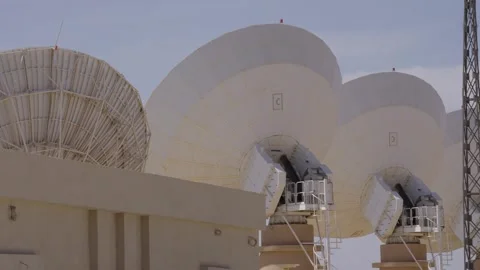 Generations of Satellite Technology at a Ground Station Stock Footage 318528565
