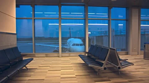 Generic Airport Interior Empty Gate Departure Lounge with Parked Jet Stock Footage 144277350