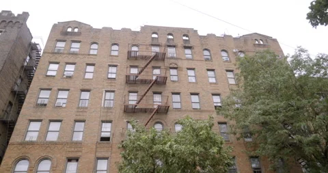 Generic apartment building brick trees grey sky medium size 5-story Brooklyn Vídeo Stock 158063115