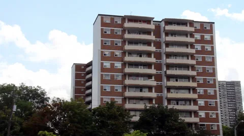 Generic Apartment Building with Clouds moving in behind.  CC Flat. Stock Footage 42683823
