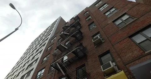 Generic apartment building establishing shot exterior DX day time facade Vídeos de archivo 81282011