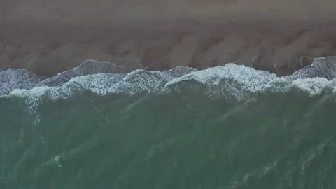 Generic Beach and Ocean Pattern on Cloudy Day, Top Down Overhead Aerial Birds Video stock 139640370