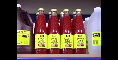 Generic black and gold no label cheap grocery products Australia 1990s Stock-Footage 318276168