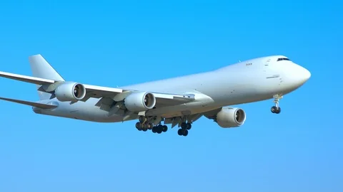 Generic Cargo Freighter Airplane Landing from a Blue Sky Video stock 102485280