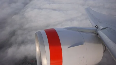 Generic jet flying over clouds approaching LAX airport. Stock Footage 87833933