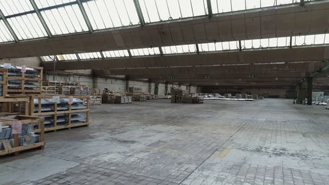 Generic long industrial warehouse with random inventory, drone aerial 4K Stock Footage 101182467