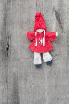 Generic machine made christmas peg dolly ornament on rustic style background Stock Photos