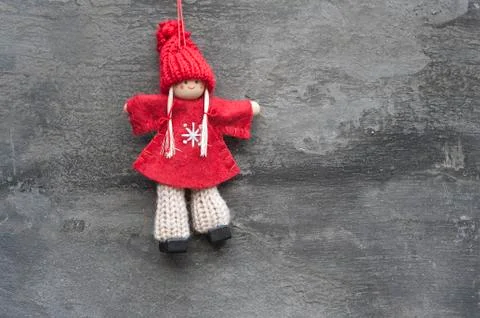 Generic machine made christmas peg dolly ornament on rustic style background Foto stock