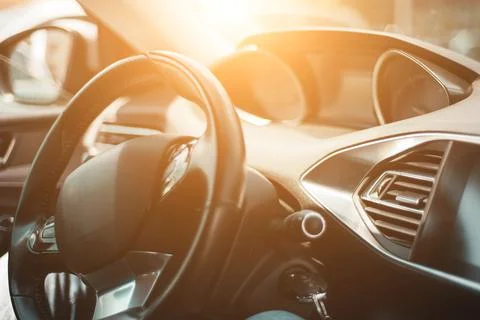 Generic modern car interior in the sunlight Stock Photos