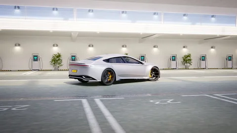 Generic modern self driving car driving out of luxury charging park garage Stock Footage 234638771