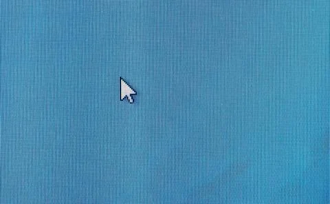 Generic mouse cursor pointer on a desktop PC monitor computer teal display .. Stock Photos