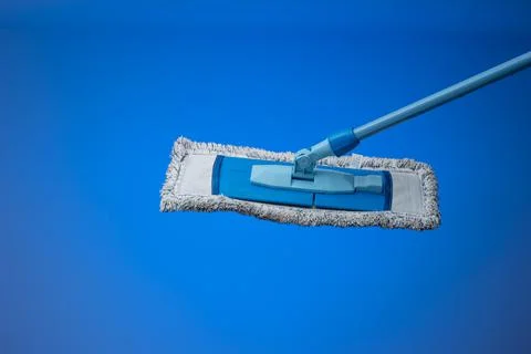 Generic plastic sweeping mop with a dirty textile sponge. Close up studio sho Stockfoto's