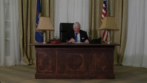 Generic President   close up getting up from desk in oval office Stock Footage 72961520