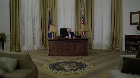 Generic President   Gets up to leave oval office Stock Footage 72961783