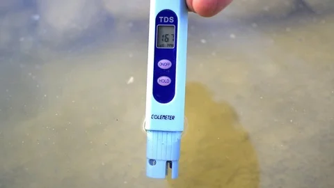Generic Salinity Meter. Hand holding steadily  Marine Salt test. Video stock 117369957