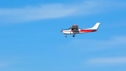 Generic Small Private Airplane Flying in a Sunny Blue Sky Stock Footage 119671830