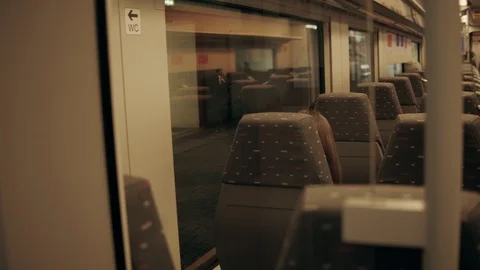 Generic speed train coming out of tunnel with commuters Video stock 110924571