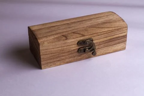A generic studio product shot of a traditionally crafted wood box on a plain  Foto stock