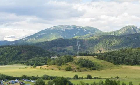 Generic summer landscape with forest and meadows Stock Photos