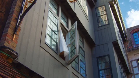 Generic typical sight in center town city of north europe house with open win Video stock 110924614