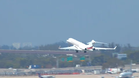 Generic Unmarked Business Jet Taking Off from Airport Stock Footage 103587073