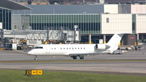 Generic White Unmarked Jet Airplane Taxiing at an Airport Stock Footage 146190308